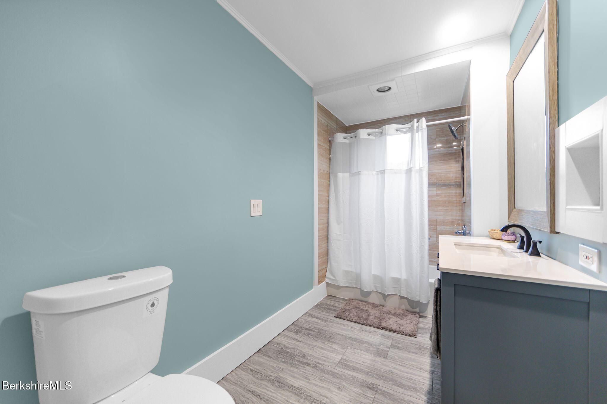 103 Holmes Road Hinsdale, MA 01235 - Photo 15 of 30 a bathroom with a granite countertop sink toilet and shower