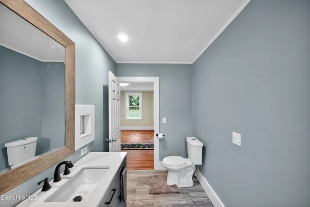 a bathroom with a sink toilet and a bathtub
