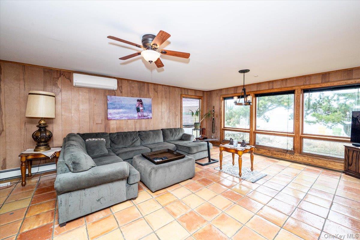 2 Shore Road East Patchogue, NY 11772 - Photo 18 of 34 a living room with furniture and a large window