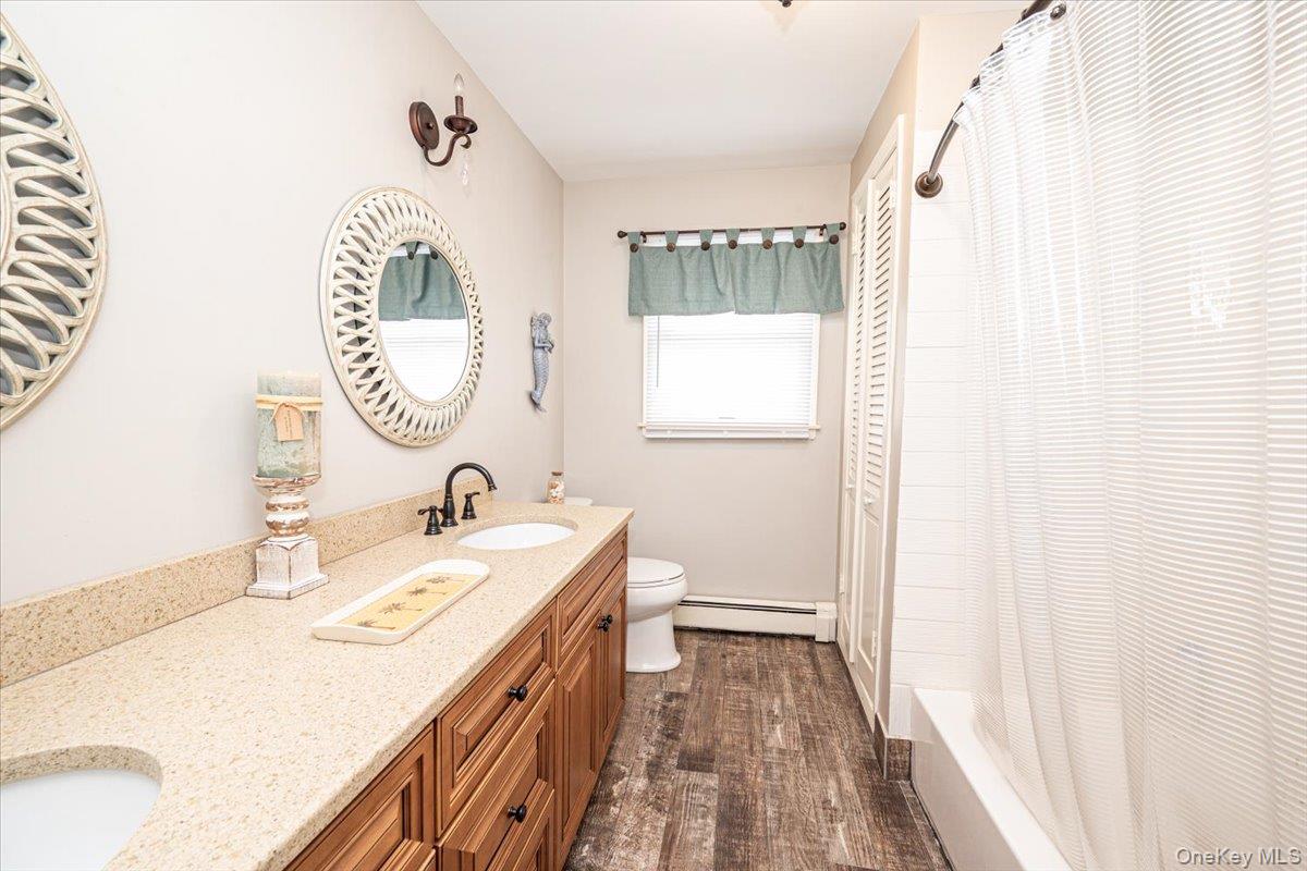 2 Shore Road East Patchogue, NY 11772 - Photo 30 of 34 a bathroom with a sink and a mirror