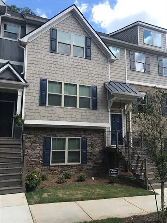 a front view of a house with yard