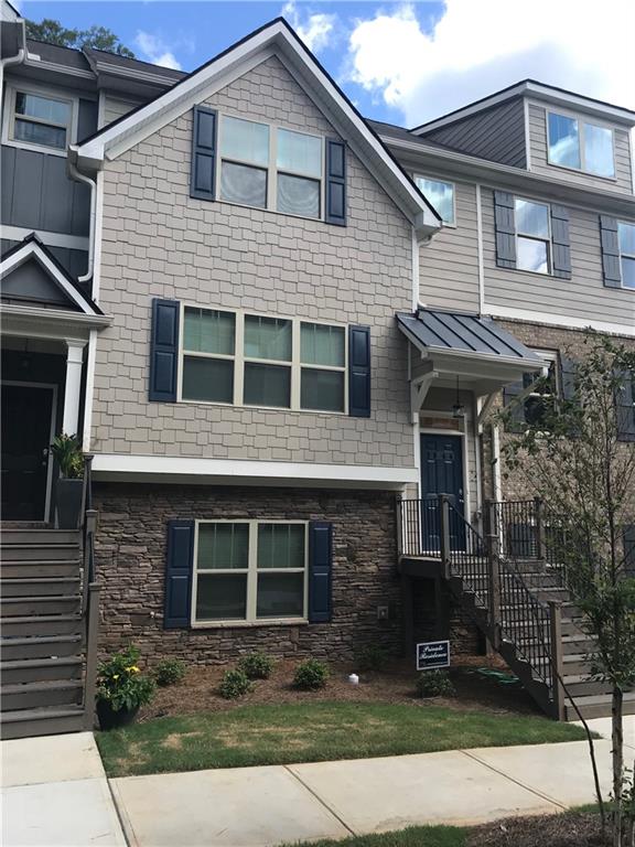 3844 Equity Lane Powder Springs, GA 30127 - Photo 2 of 38 a front view of a house with yard