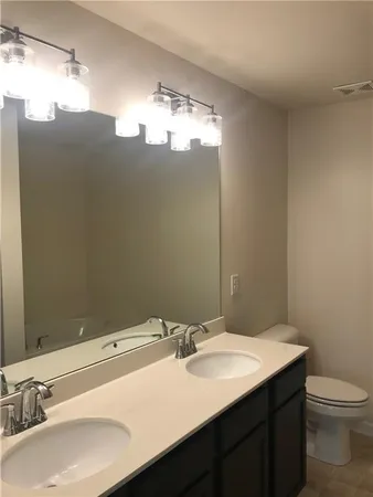 a bathroom with a sink and mirror