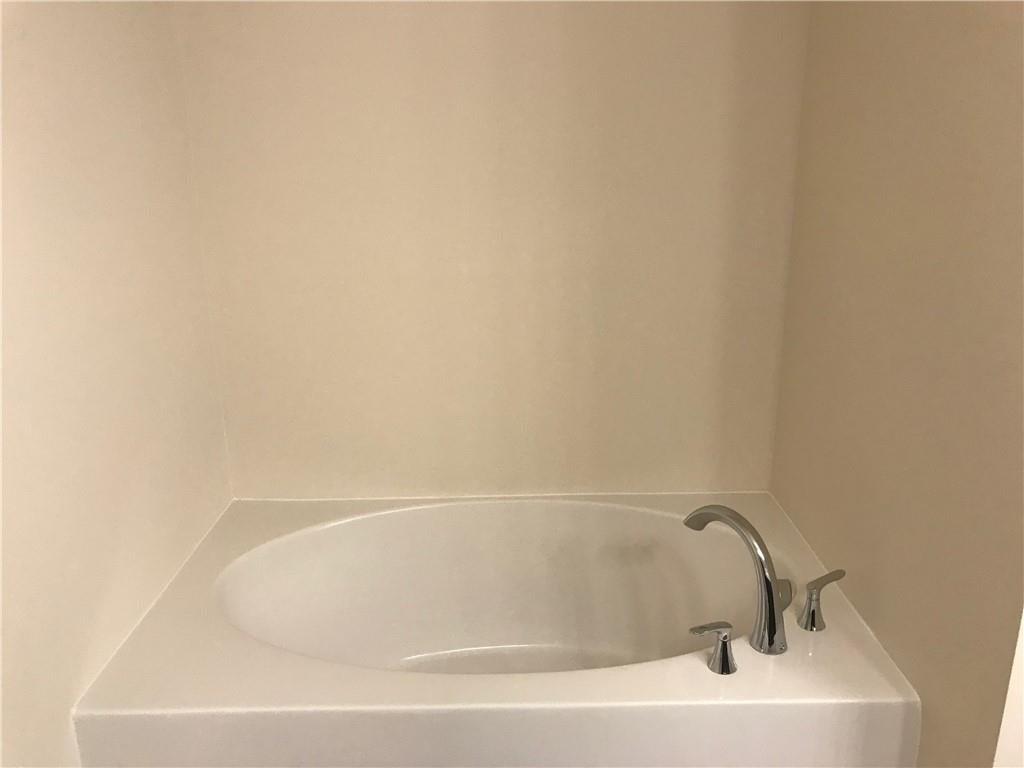 3844 Equity Lane Powder Springs, GA 30127 - Photo 24 of 38 a bathroom with a bathtub