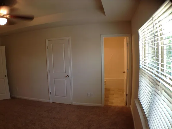 a view of hallway with a window