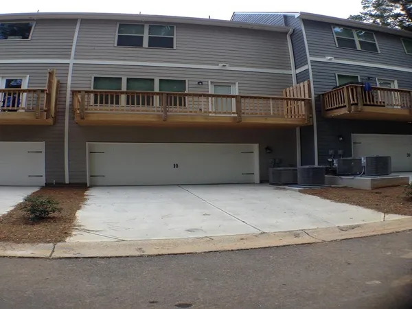 a front view of a house with a garage
