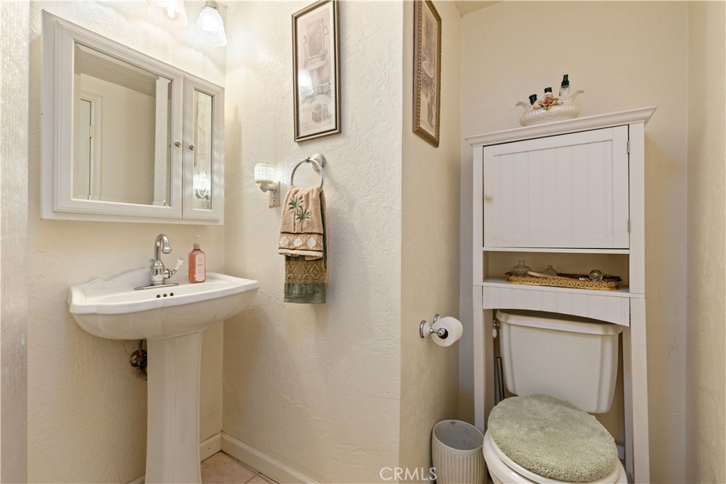 10311 Redwood Road Middletown, CA 95461 - Photo 18 of 48 a bathroom with a sink a toilet and shower