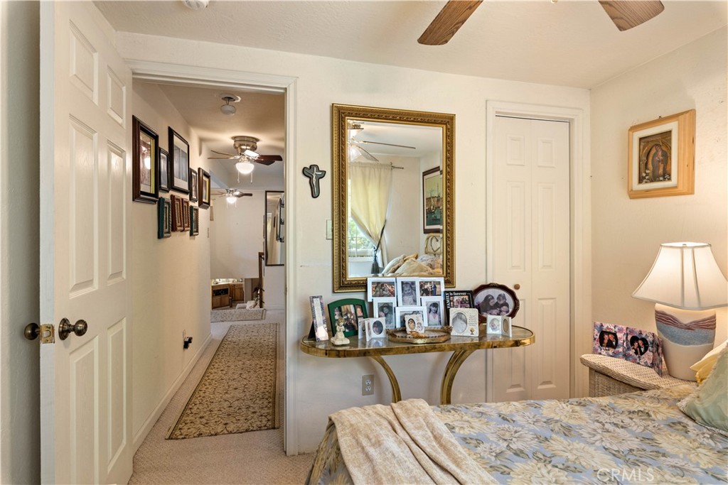 10311 Redwood Road Middletown, CA 95461 - Photo 20 of 48 a bedroom with a bed a table and chair