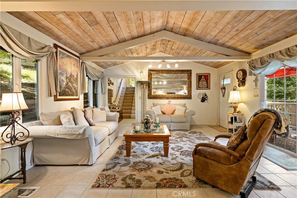 10311 Redwood Road Middletown, CA 95461 - Photo 2 of 48 a living room with furniture and a chandelier