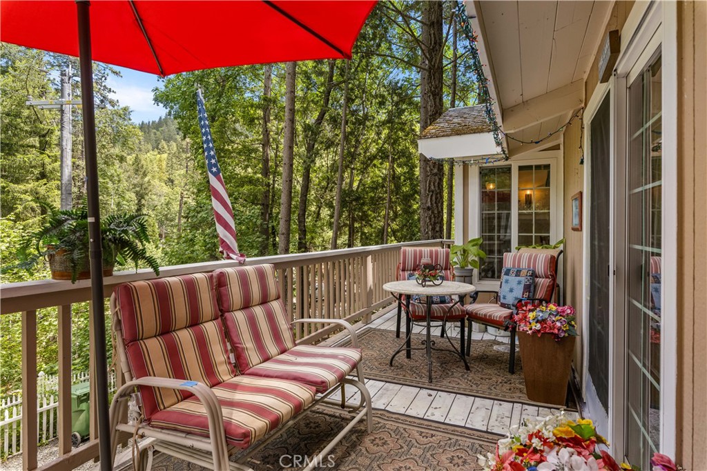 10311 Redwood Road Middletown, CA 95461 - Photo 24 of 48 a balcony with wooden floor and outdoor seating