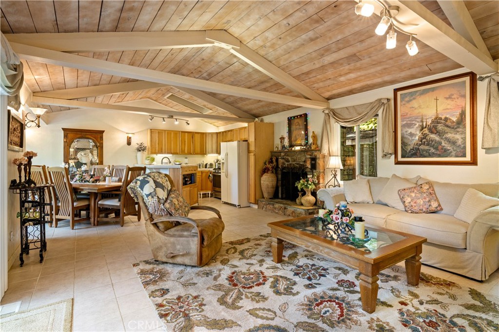 10311 Redwood Road Middletown, CA 95461 - Photo 3 of 48 a living room with furniture a dining table and a chandelier