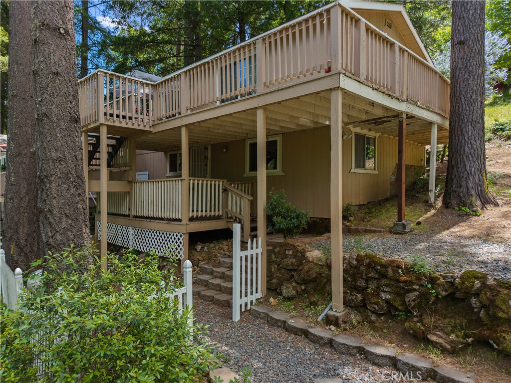 10311 Redwood Road Middletown, CA 95461 - Photo 37 of 48 a front view of a house with garden