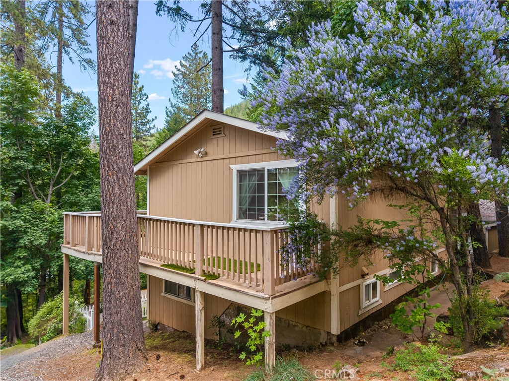 10311 Redwood Road Middletown, CA 95461 - Photo 38 of 48 a view of a house with a yard and deck