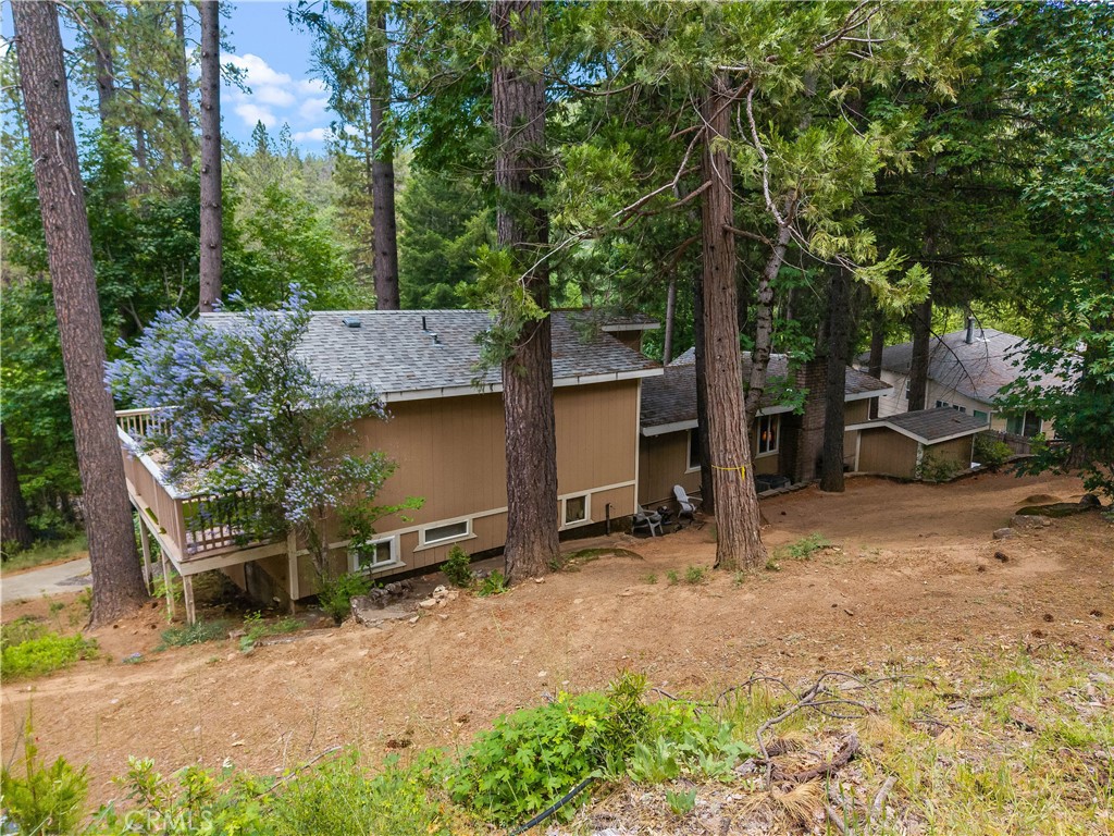 10311 Redwood Road Middletown, CA 95461 - Photo 39 of 48 a backyard of a house with barbeque oven table and chairs