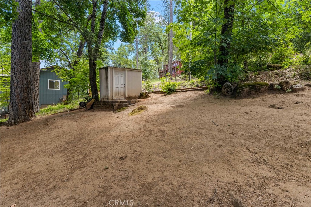 10311 Redwood Road Middletown, CA 95461 - Photo 42 of 48 a view of a house with a tree