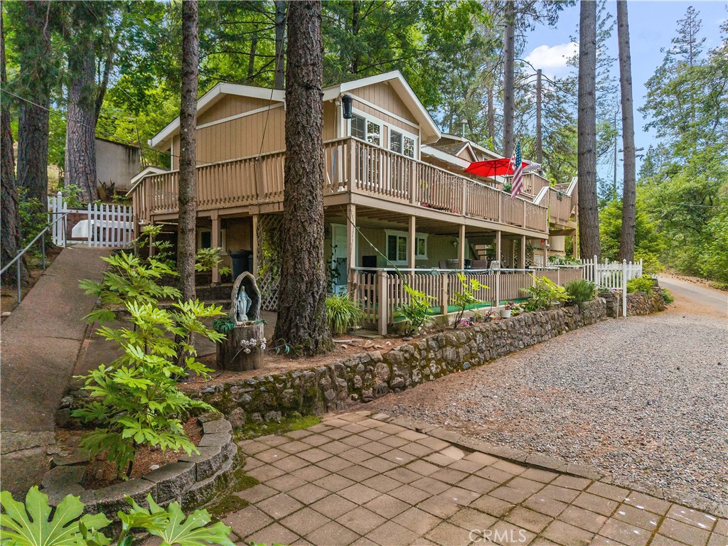 10311 Redwood Road Middletown, CA 95461 - Photo 46 of 48 a front view of a house with a garden