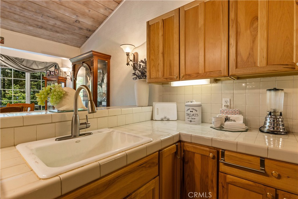 10311 Redwood Road Middletown, CA 95461 - Photo 7 of 48 a kitchen with a sink and cabinets
