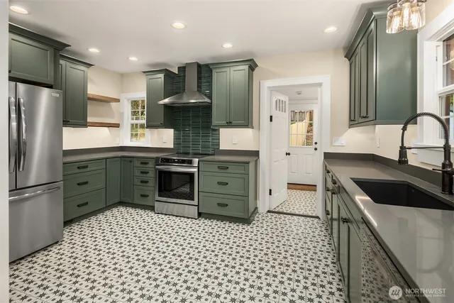 a kitchen with a sink a stove and refrigerator