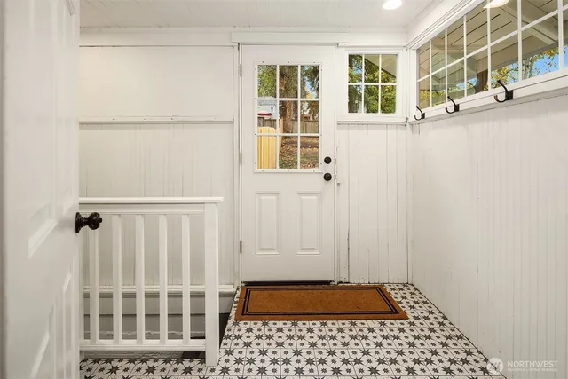 a view of a door and a window