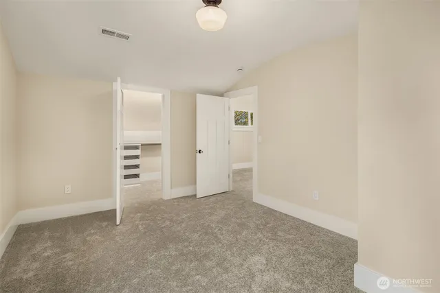an empty room with furniture and closet