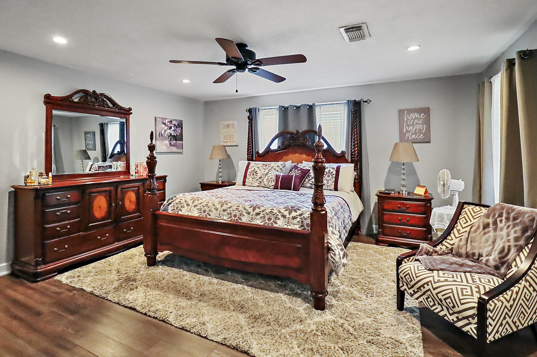 15321 Lindstrom Road Crosby, TX 77532 - Photo 14 of 50 a bedroom with a bed a couch and dresser