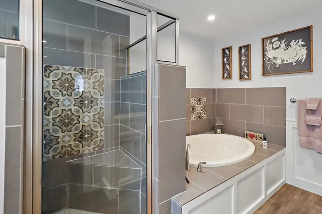 a bathroom with a shower and a sink