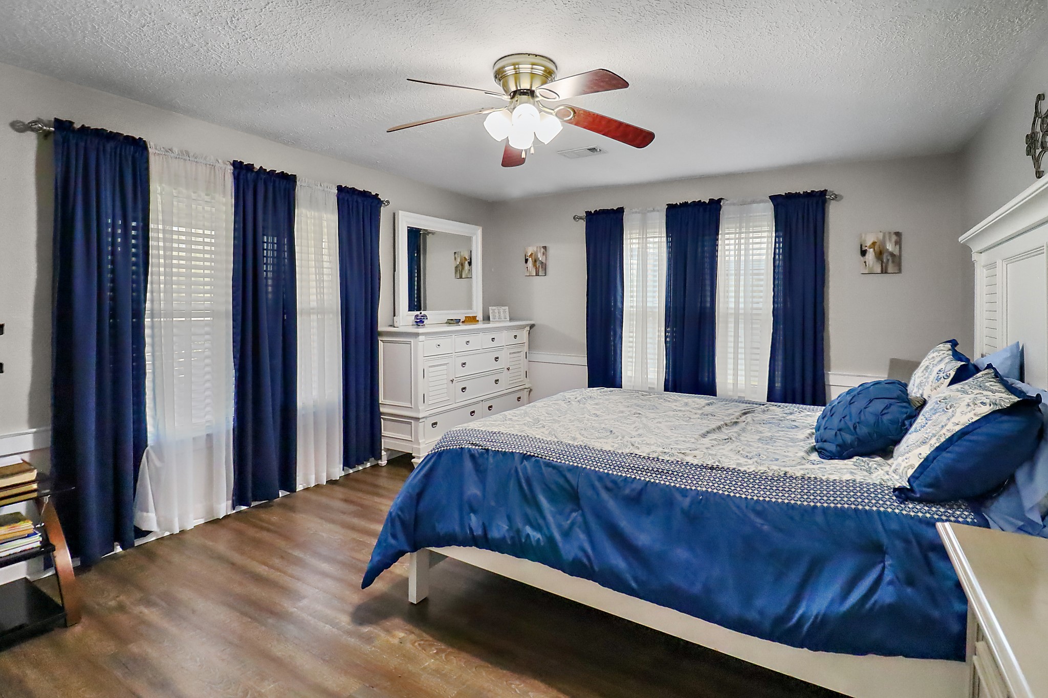 15321 Lindstrom Road Crosby, TX 77532 - Photo 18 of 50 a bed room with a bed and a chandelier
