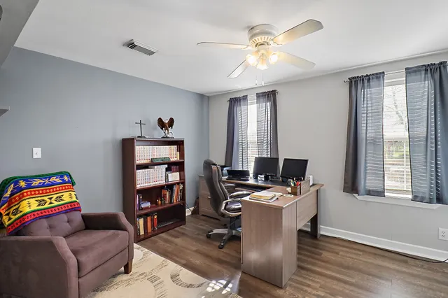 a work room with furniture and window