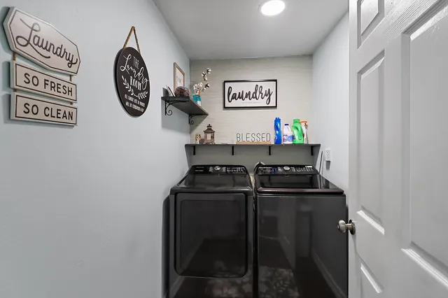 a kitchen with a refrigerator and a stove