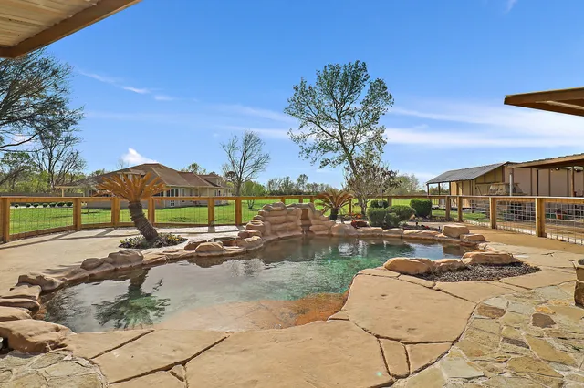 a view of a backyard with a patio