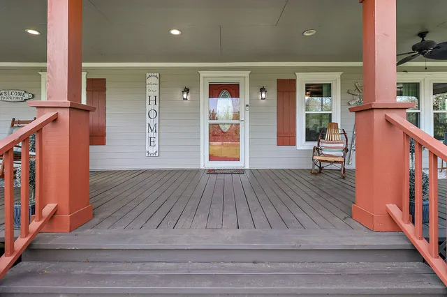 a room with wooden floor and furniture