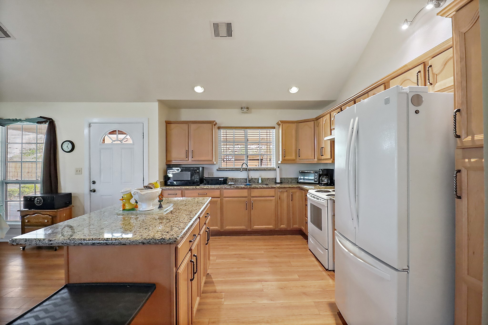 15321 Lindstrom Road Crosby, TX 77532 - Photo 41 of 50 a kitchen with stainless steel appliances granite countertop a refrigerator a stove and a sink