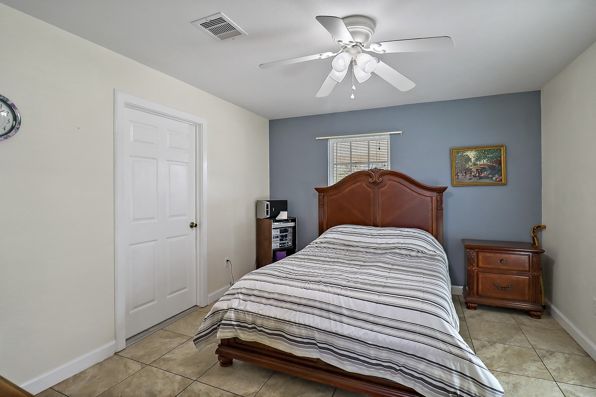 15321 Lindstrom Road Crosby, TX 77532 - Photo 42 of 50 a bedroom with a bed and a chandelier