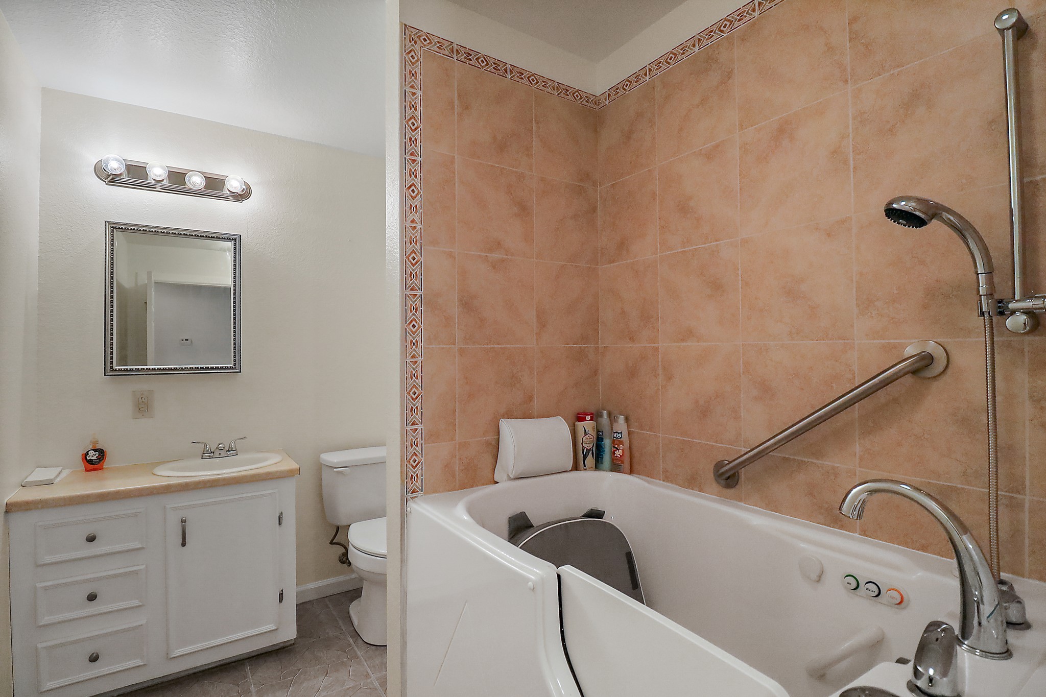 15321 Lindstrom Road Crosby, TX 77532 - Photo 46 of 50 a bathroom with a tub sink and mirror