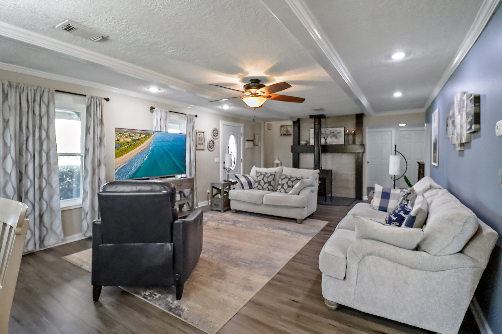 15321 Lindstrom Road Crosby, TX 77532 - Photo 6 of 50 a living room with furniture and a flat screen tv