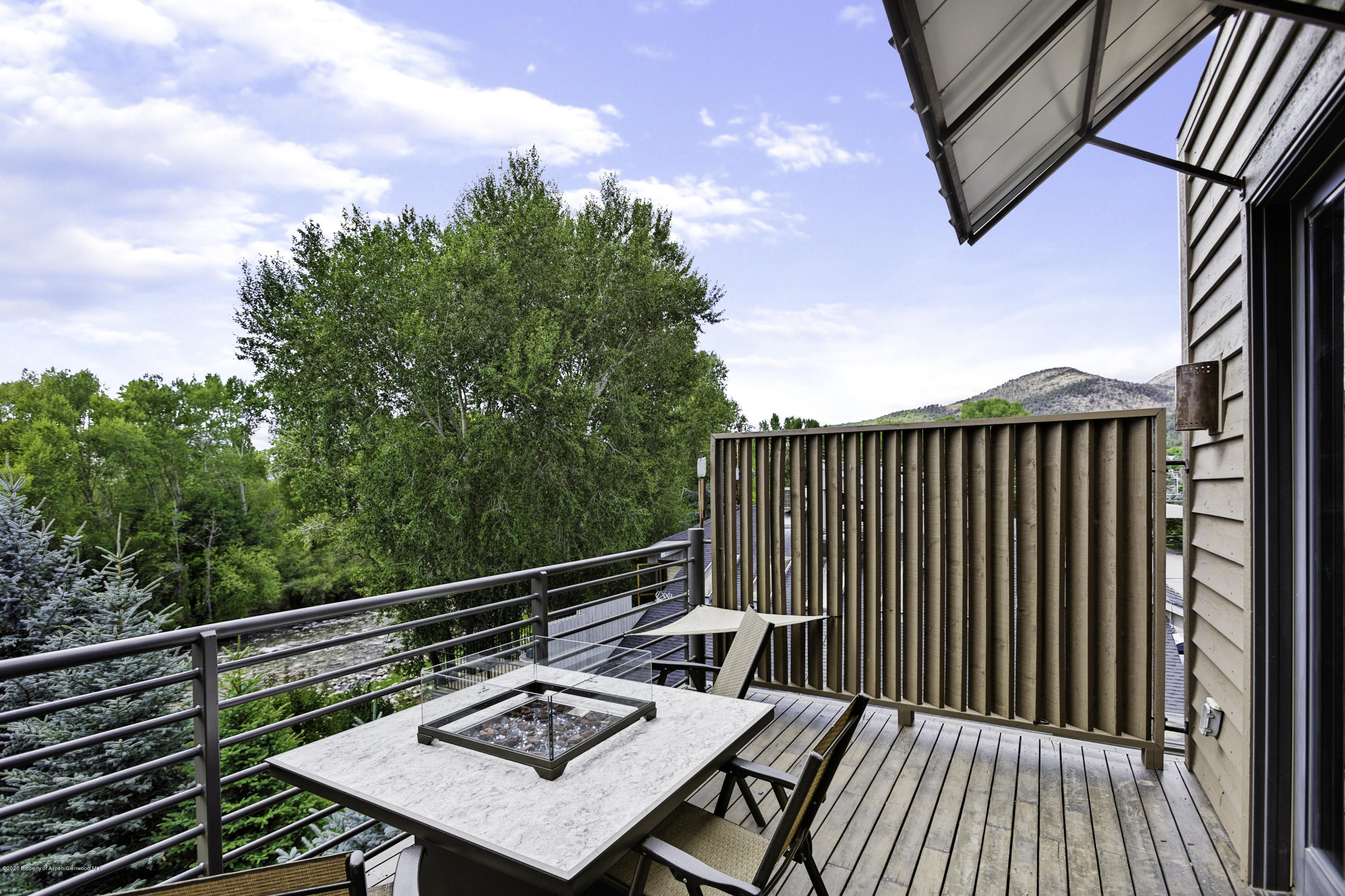 23272 2 Rivers Road, Unit 301 Basalt, CO 81621 - Photo 11 of 16 a balcony with wooden floor and fence