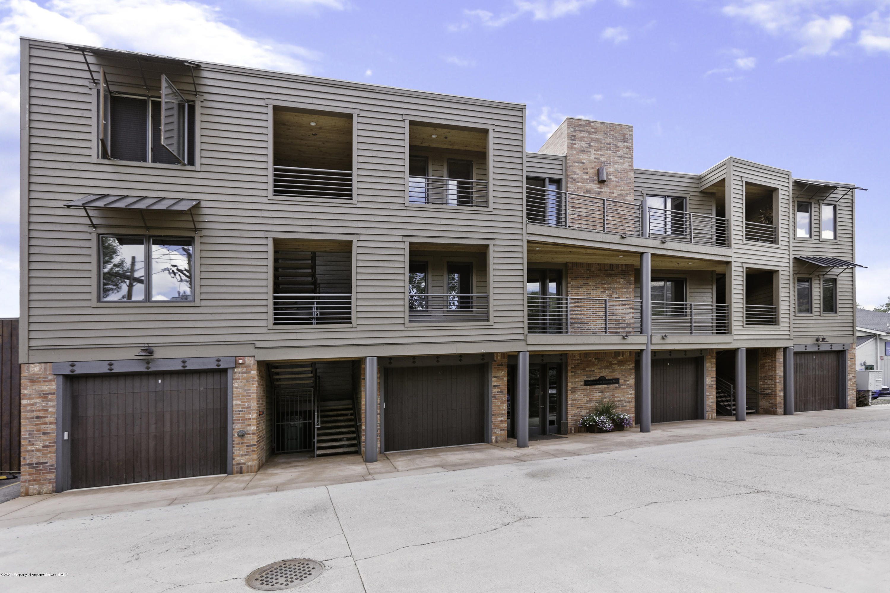 23272 2 Rivers Road, Unit 301 Basalt, CO 81621 - Photo 16 of 16 a front view of a building with many windows
