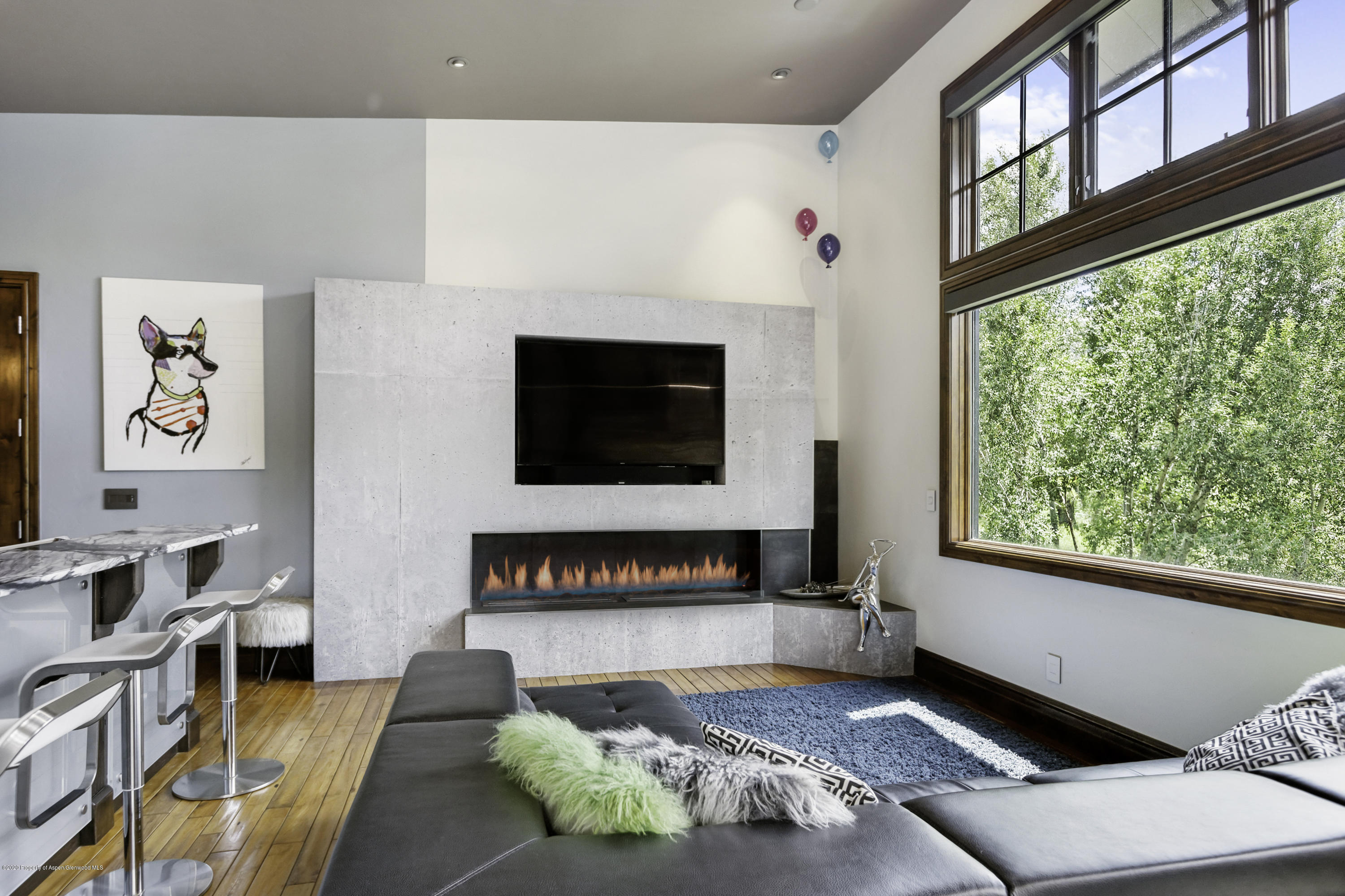 23272 2 Rivers Road, Unit 301 Basalt, CO 81621 - Photo 3 of 16 a living room with furniture and a flat screen tv