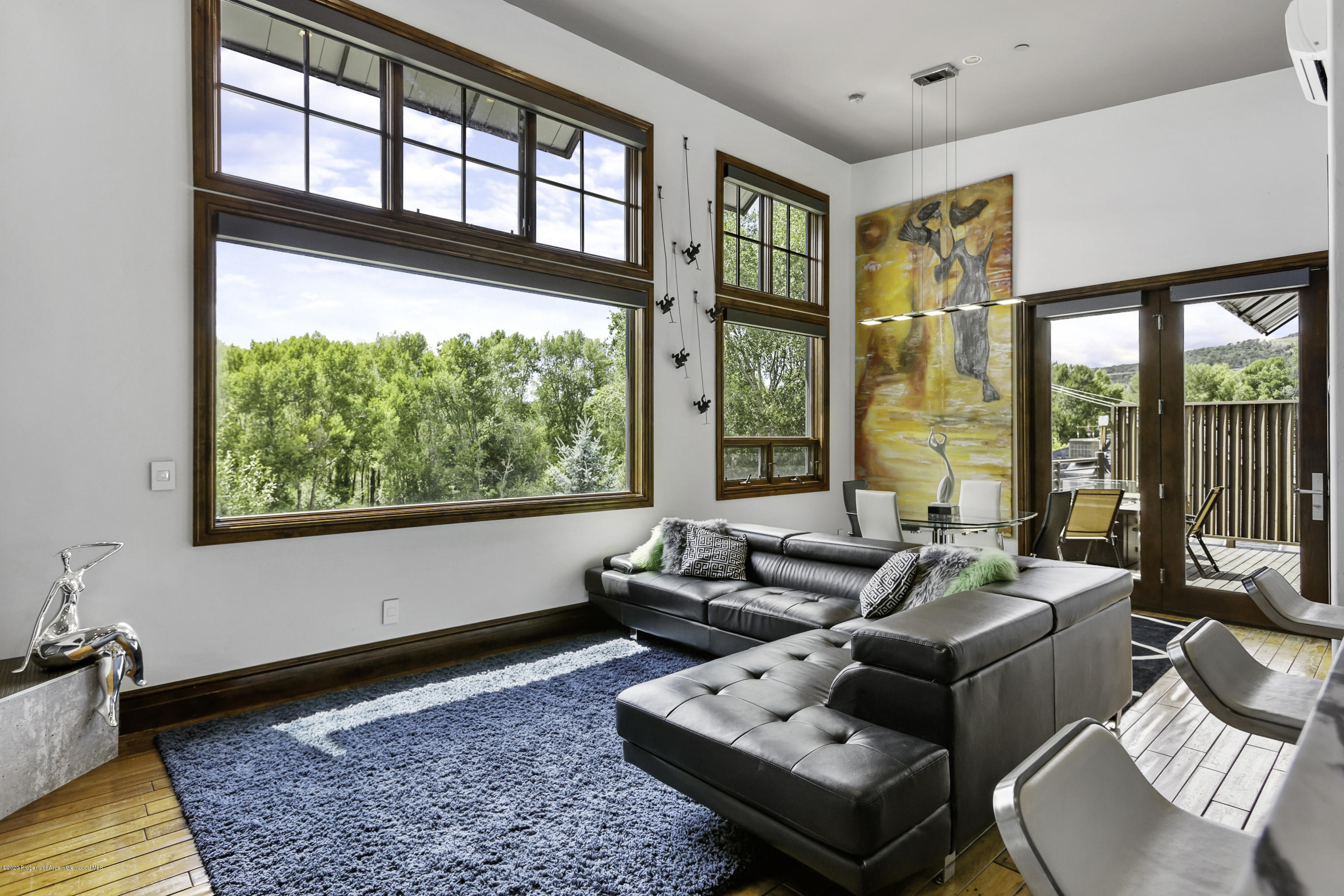 23272 2 Rivers Road, Unit 301 Basalt, CO 81621 - Photo 4 of 16 a living room with furniture and a floor to ceiling window