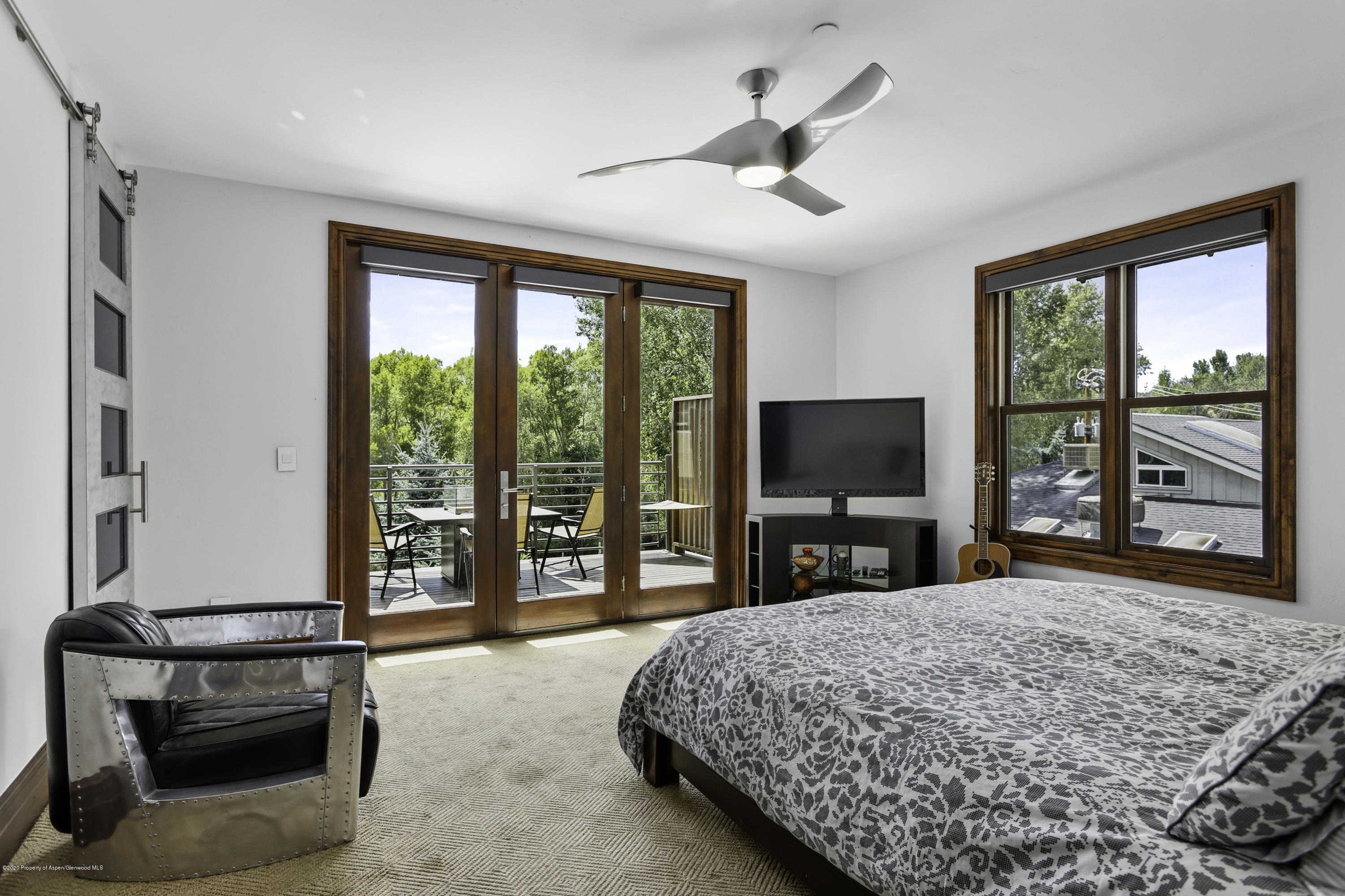 23272 2 Rivers Road, Unit 301 Basalt, CO 81621 - Photo 5 of 16 a bedroom with a bed and a television