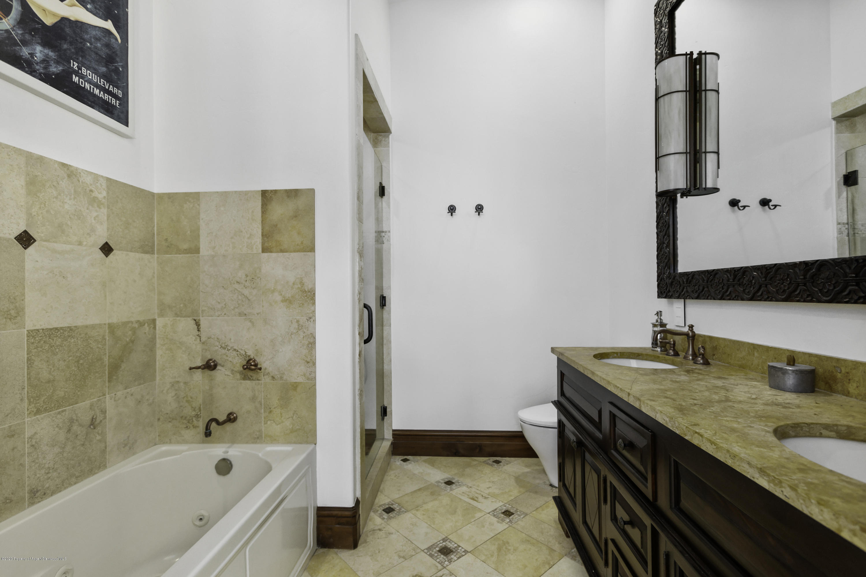 23272 2 Rivers Road, Unit 301 Basalt, CO 81621 - Photo 6 of 16 a bathroom with a granite countertop sink a mirror and a bathtub