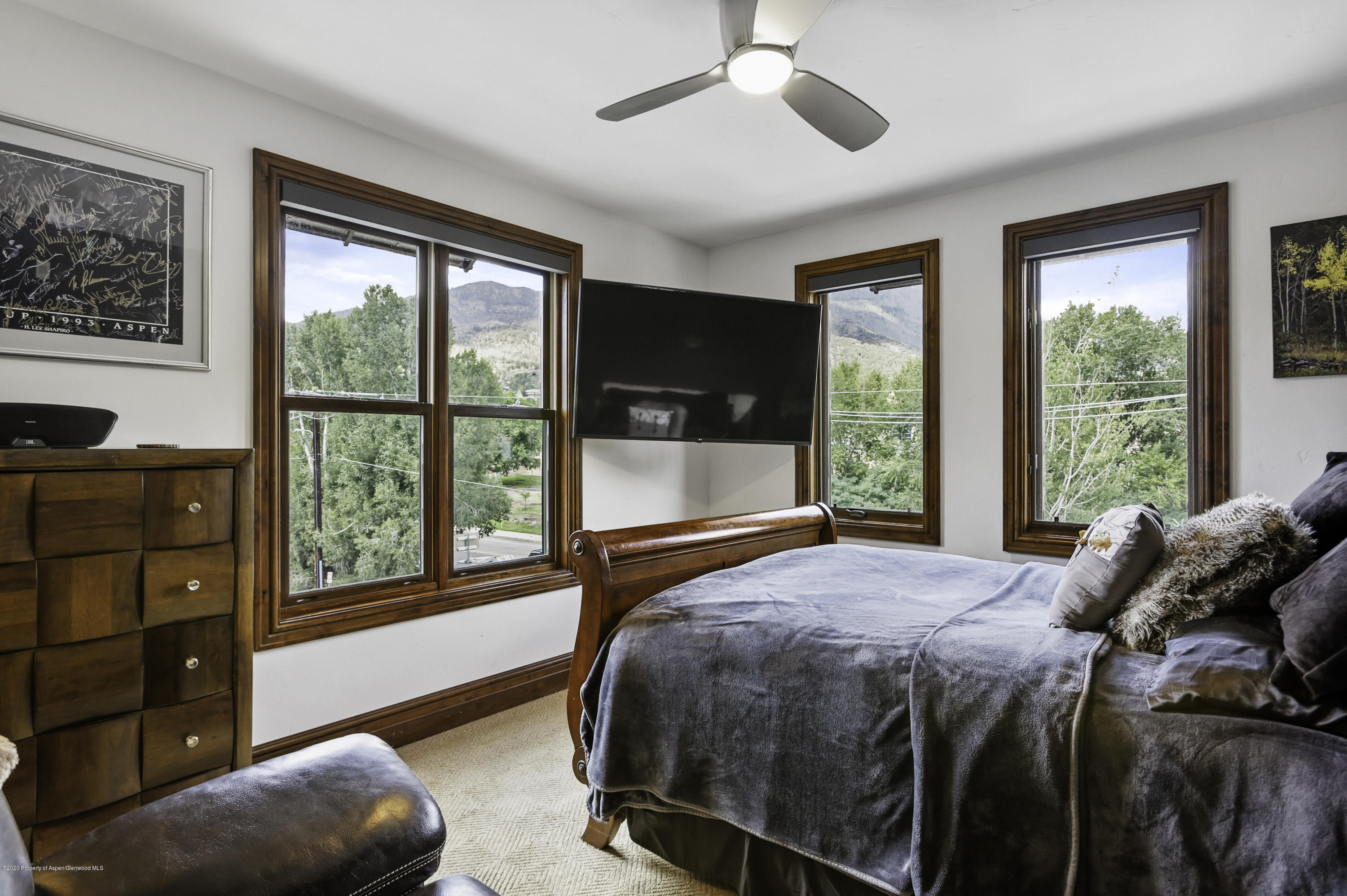 23272 2 Rivers Road, Unit 301 Basalt, CO 81621 - Photo 7 of 16 a bedroom with a bed and a large window