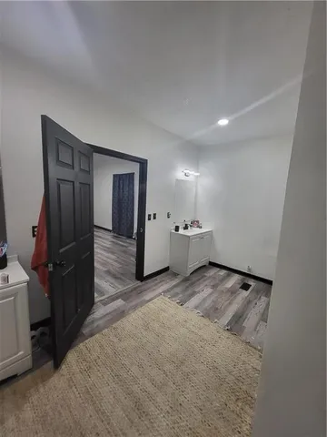 a view of an empty room and a window