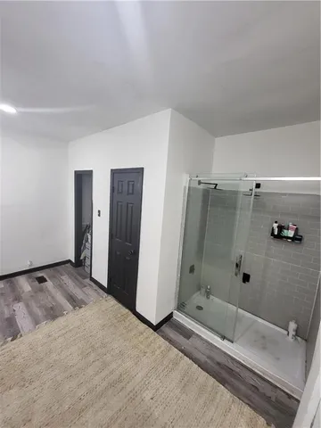 a bedroom with furniture and a book shelf