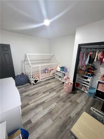 a bedroom with a bed and cabinets