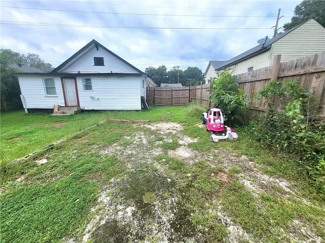 a view of a house with a yard porch and sitting area