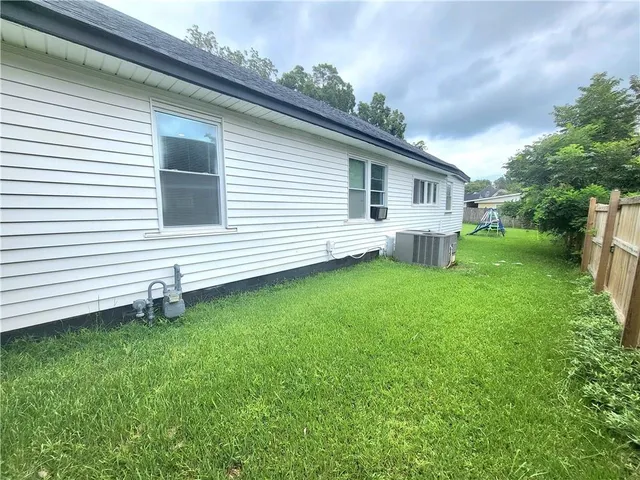 a backyard of a house with lots of green space
