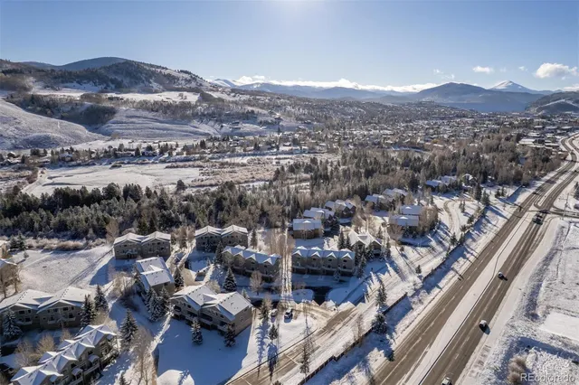 a view of a house with a backyard space and balcony