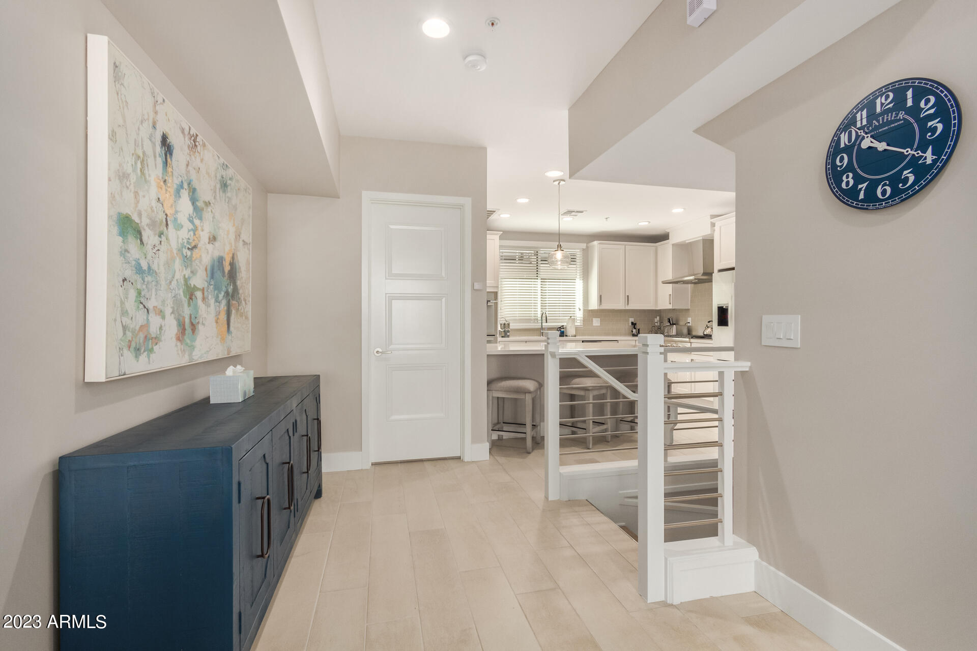 7550 East Osborn Road, Unit 1009 Scottsdale, AZ 85251 - Photo 11 of 39 a view of a kitchen with furniture and an empty room