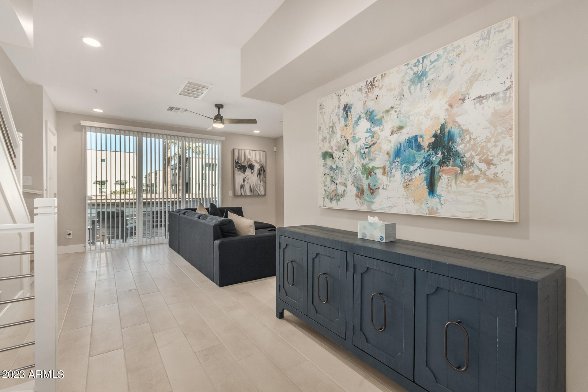7550 East Osborn Road, Unit 1009 Scottsdale, AZ 85251 - Photo 12 of 39 a large living room with stainless steel appliances kitchen island granite countertop furniture a large window
